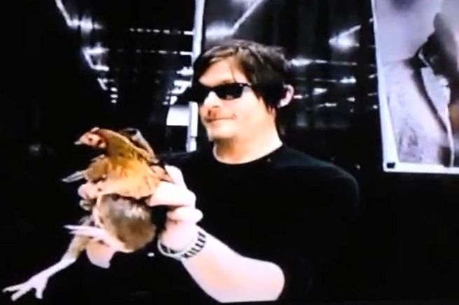 Norman Reedus Holding chicken