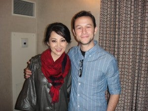 Summer Qing with her co-star, Joseph Gordon-Levitt, on the set of LOOPER.