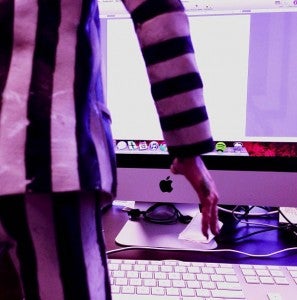 Beetlejuice standing in front of a computer