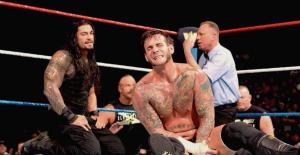 WWE’s Roman Reigns Takes A Swing At CM Punk