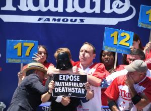 Joey Chestnut Demolishes Protestor on Way to 15th Hot Dog Eating Contest Win