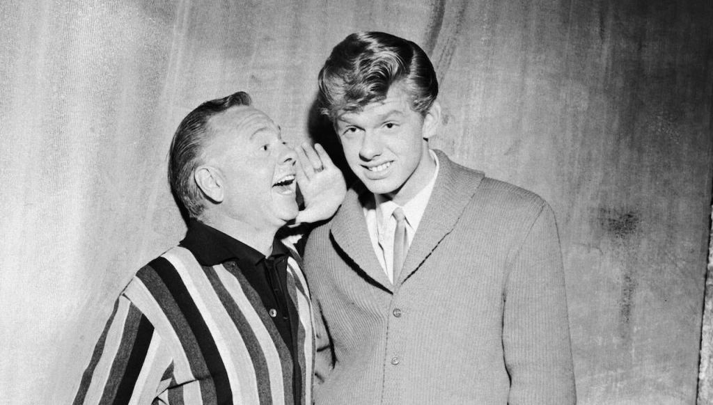 Actor Mickey Rooney Whispering to His Son on Acting Tips