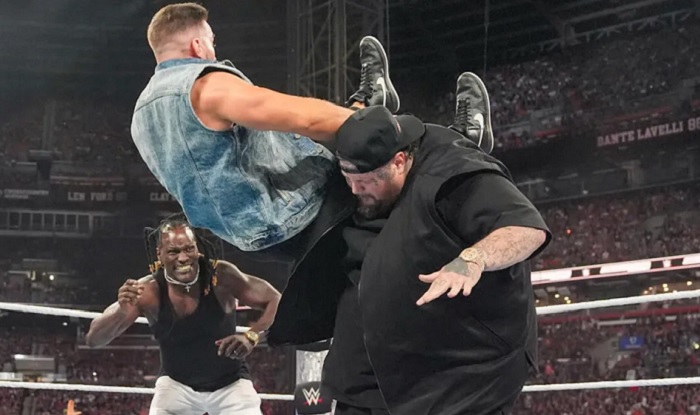 Jelly Roll delivers a chokeslam to Austin Theory at WWE SummerSlam.