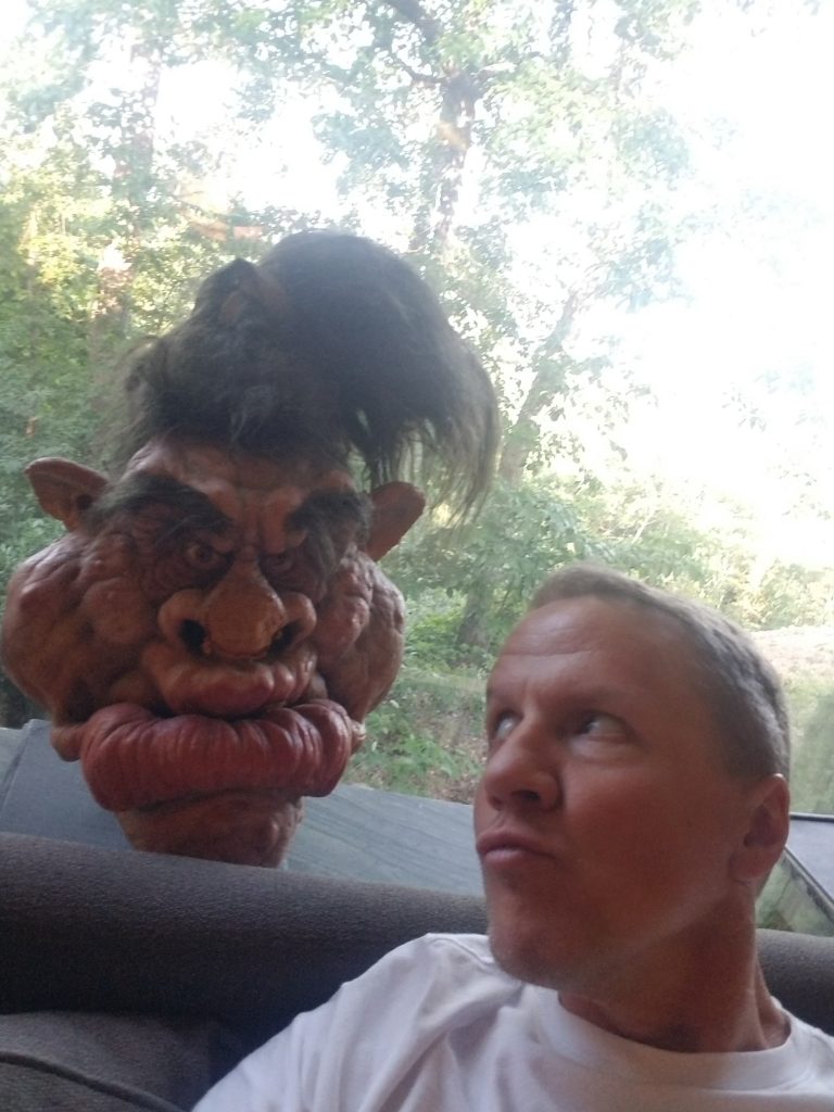 Justin Lloyd with one of the Ernest Scared Stupid troll masks.