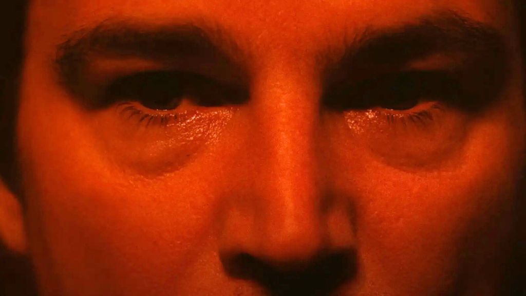 Josh Hartnett eyes bathed in red in Trap