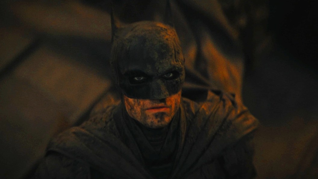 Robert Pattinson as Batman looking up in The Batman