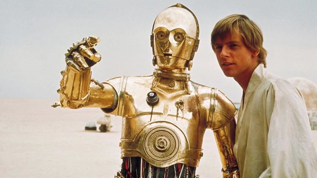 C-3PO next to Mark Hamill's Luke Skywalker in Star Wars