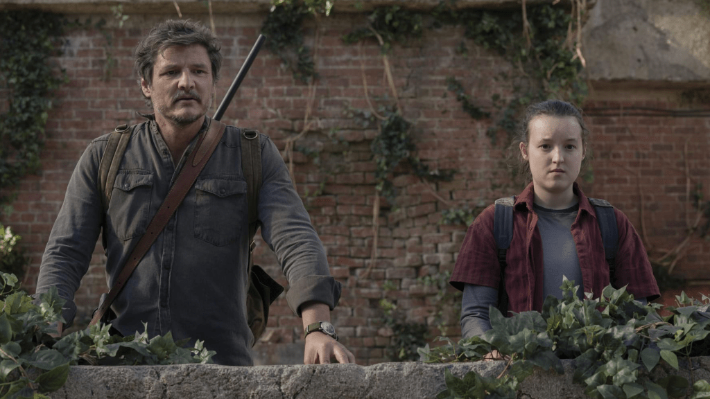 Pedro Pascal and Bella Ramsey standing next to each other in The Last of Us.