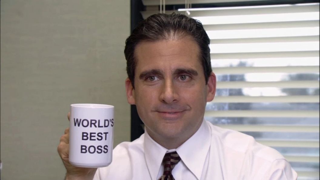 Steve Carell as Michael Scott hold a Best Boss mug in The Office