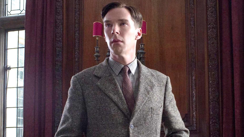 Benedict Cumberbatch as Alan Turing wearing a gray suit in The Imitation Game