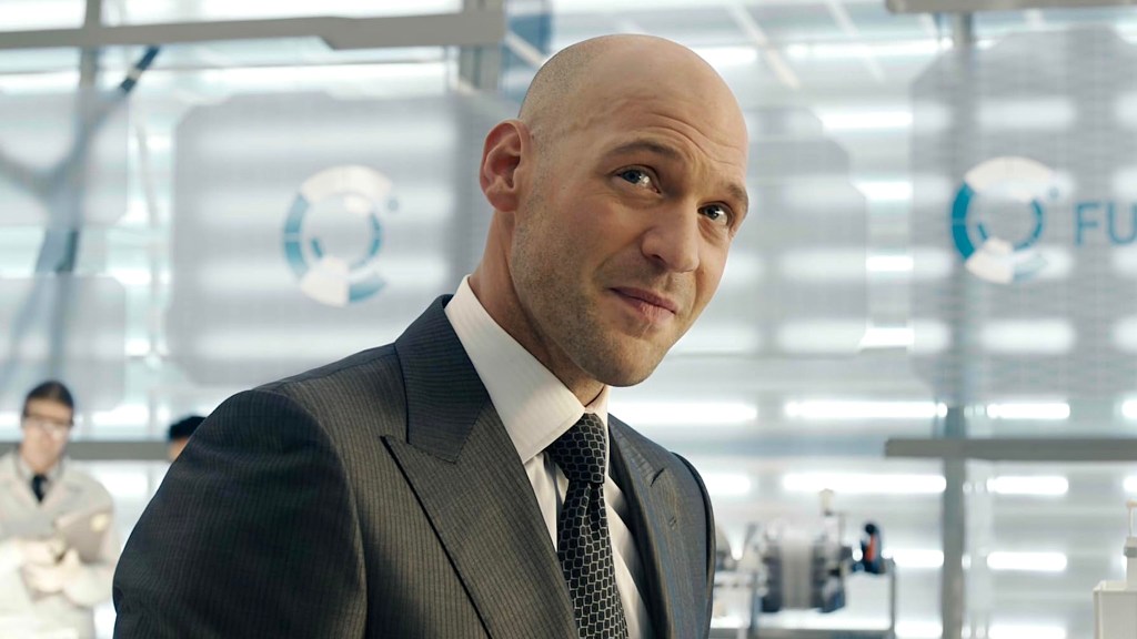 Corey Stoll as Darren Cross wearing suit in laboratory