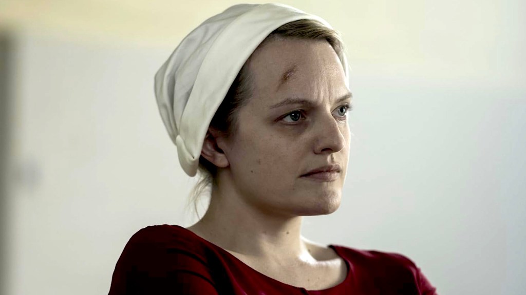 Elizabeth Moss wearing white hat in The Handmaid's Tale