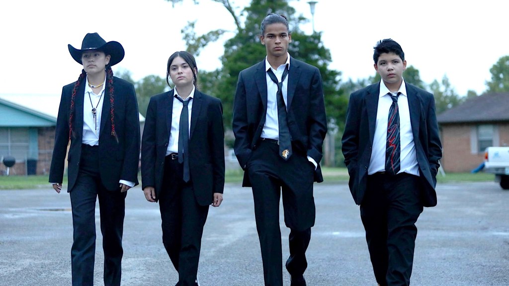 Paulina Alexis, Devery Jacobs, D'Pharaoh Woon-A-Tai, and Lane Factor wearing suits in Reservation Dogs