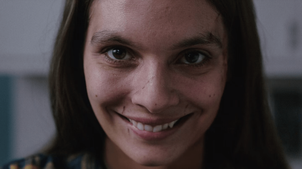 Caitlin Stasey appears in Smile