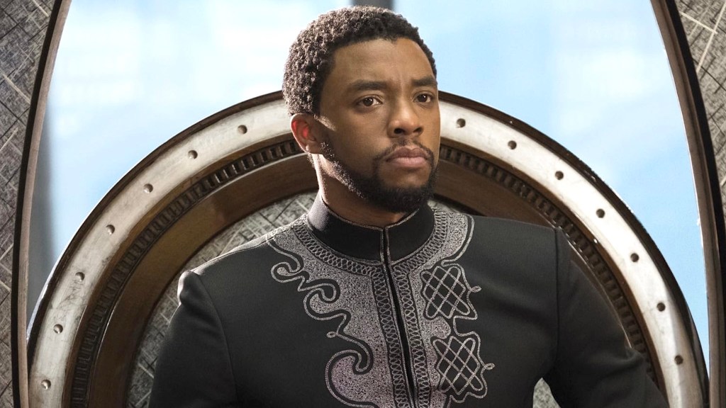 Chadwick Boseman sitting on throne as King T'Challa in Black Panther