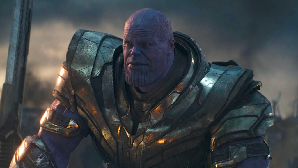 Thanos sitting, wearing golden armor in Avengers: Endgame