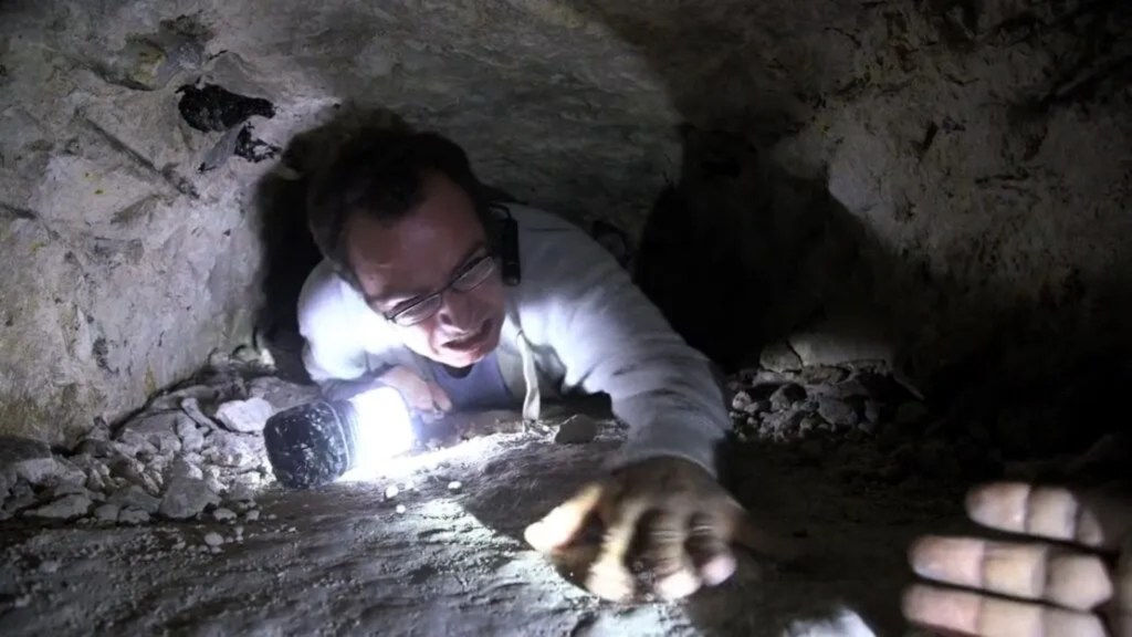 Crawling through a small cave in Final Prayer