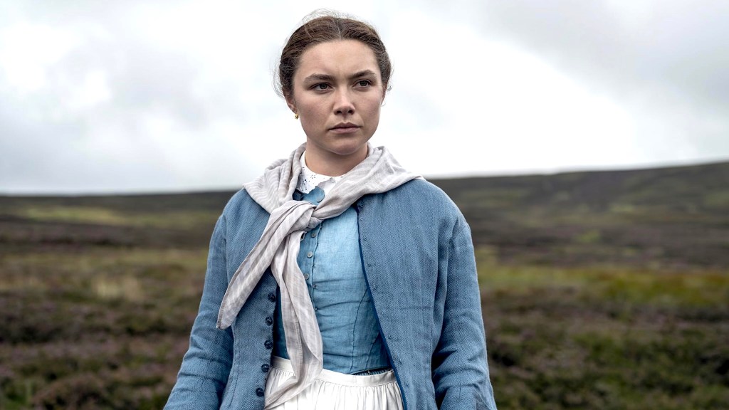 Florence Pugh wearing blue and white outfit in The Wonder