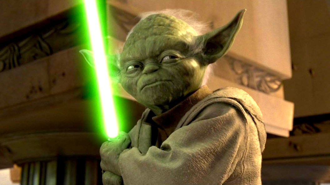 Yoda holding a green lightsaber in Star Wars: Attack of the Clones