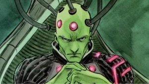 Brainiac starring with his hands clenched together.