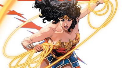 Wonder Woman swinging the Lasso of Truth and smiling on the cover to Tom King's Wonder Woman