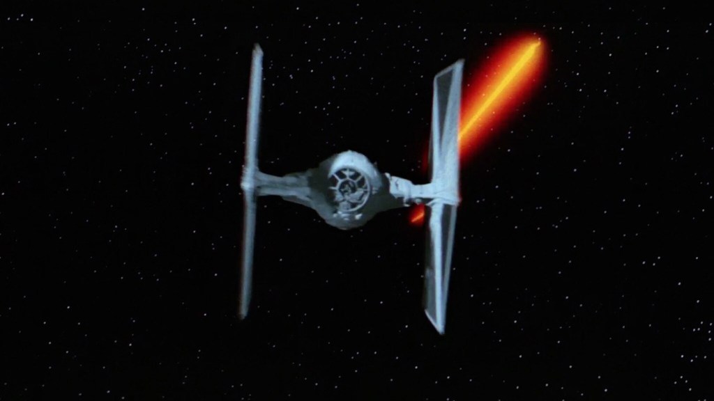 A TIE Fighter being fired at by the quadlaser turrets of the Millennium Falcon in Star Wars: Episode IV: A New Hope