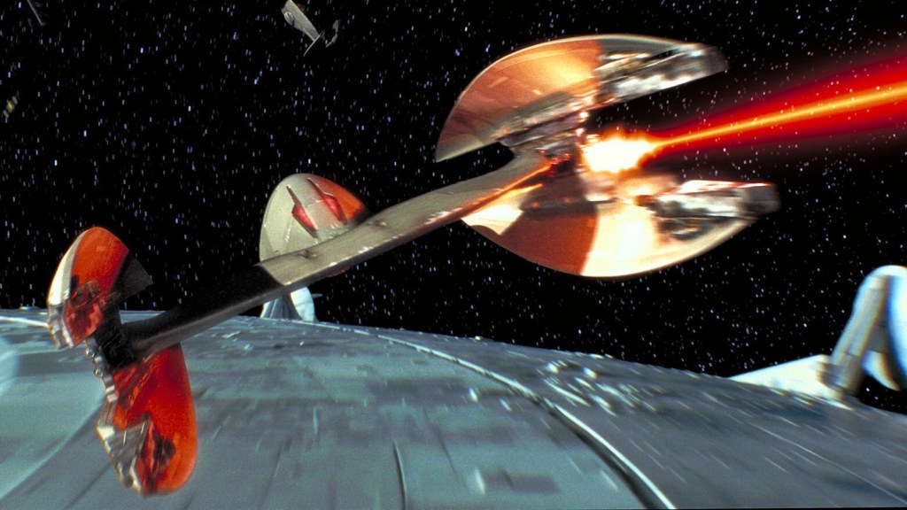 A Vulture Droid Fighter firing its laser cannons at the Battle of Naboo in Star Wars: Episode I: The Phantom Menace