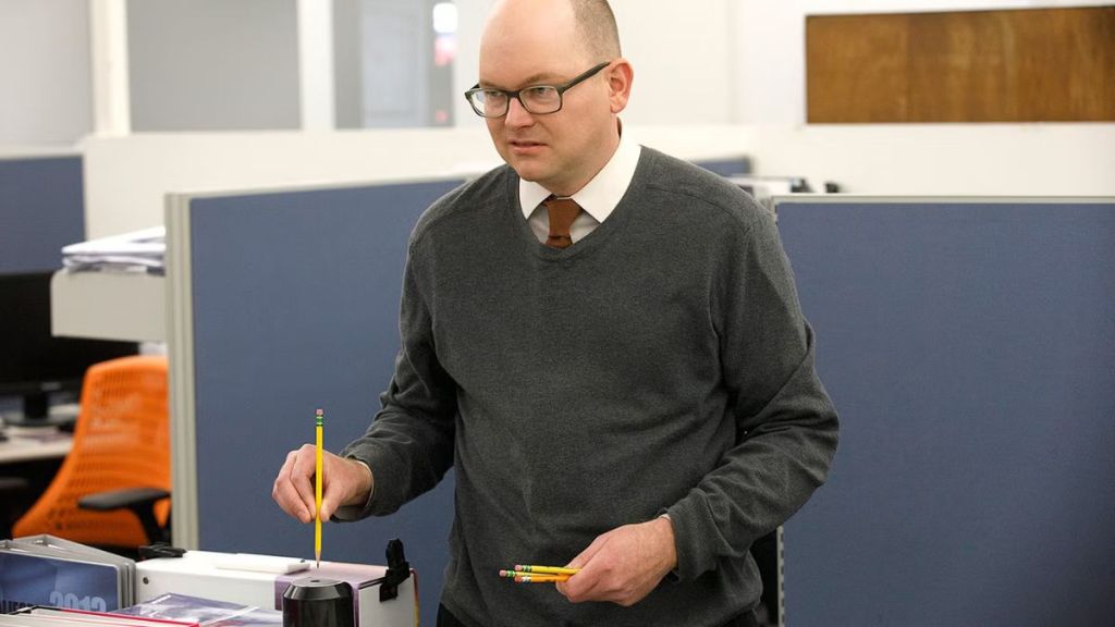 Energy vampire Colin Robinson, a character from the show What We Do In The Shadows, sharpening multiple pencils back to back