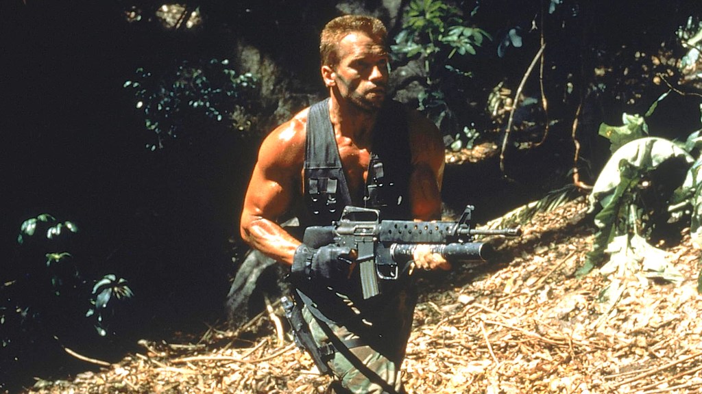 Arnold Schwarzenegger holding assault rifle in Predator