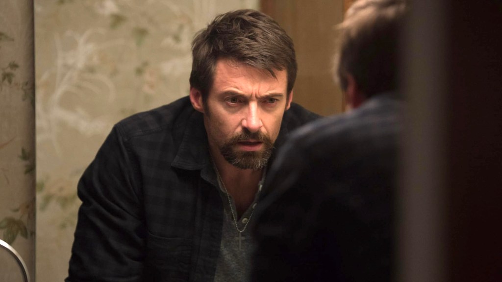 Hugh Jackman looking in a mirror in Prisoners