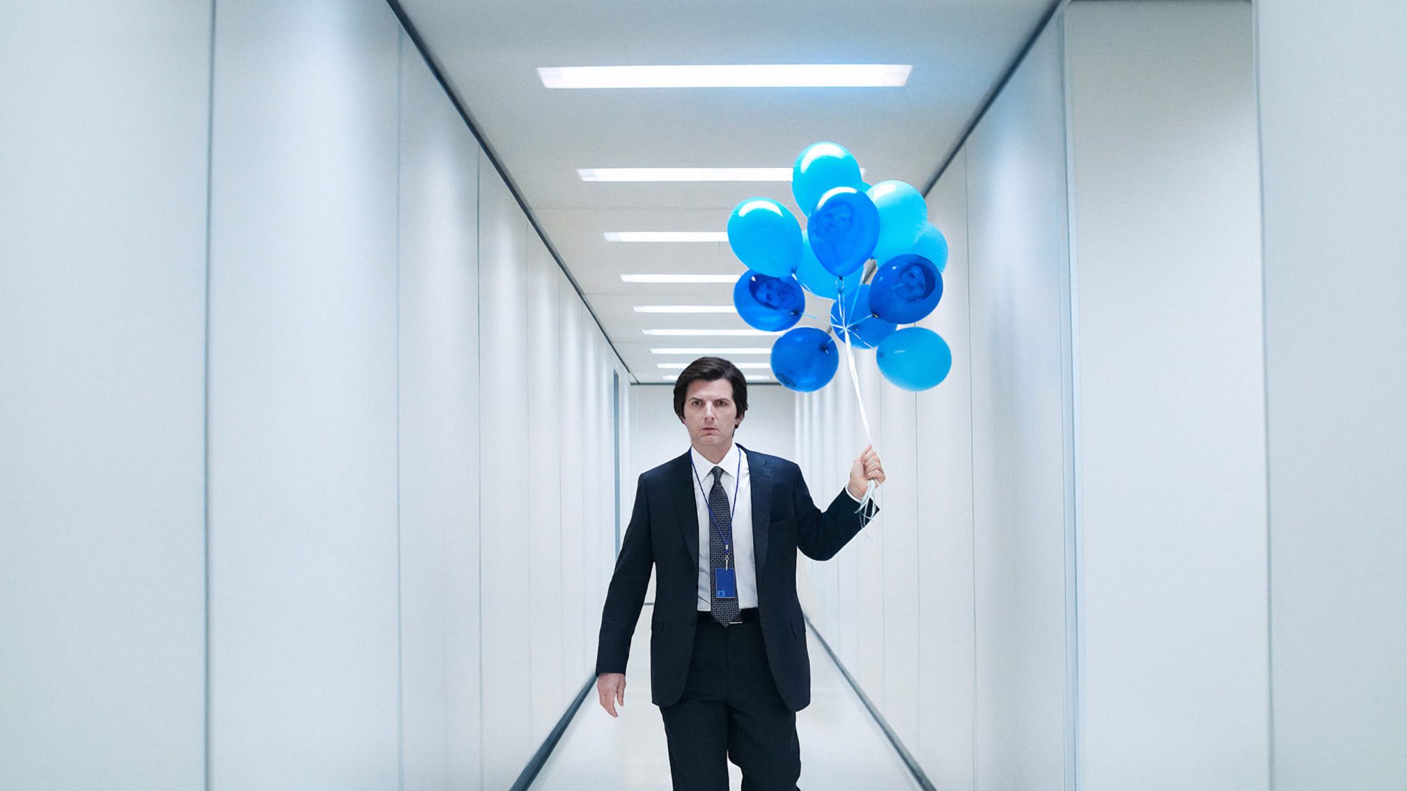 Mark S. travels down the halls with some balloons. 