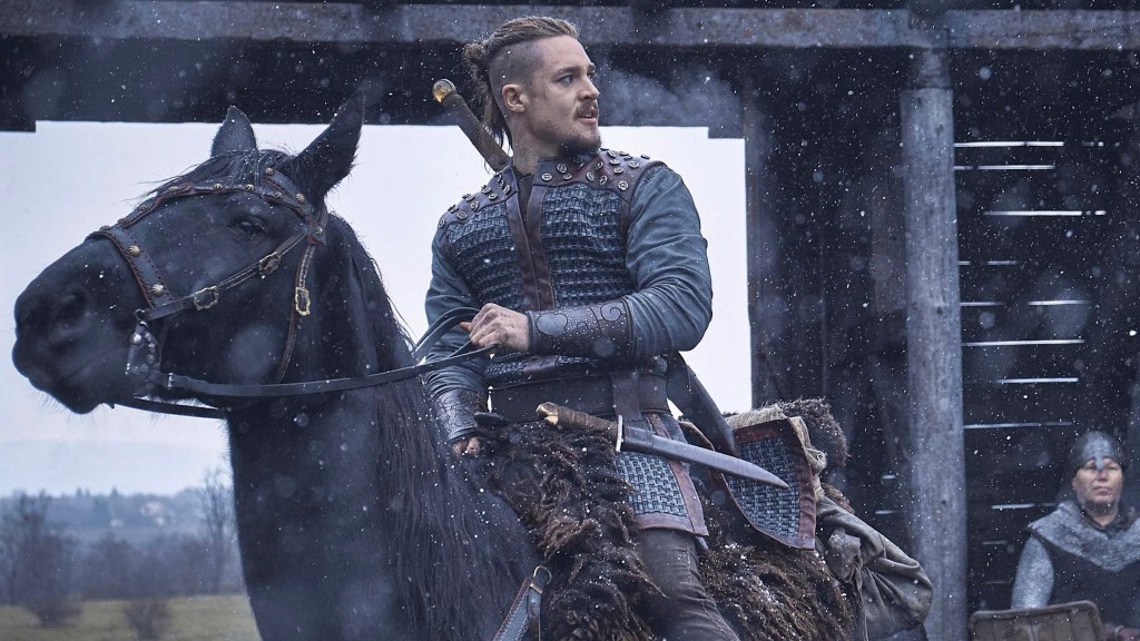 Alexander Dreymon riding a black horse in The Last Kingdom