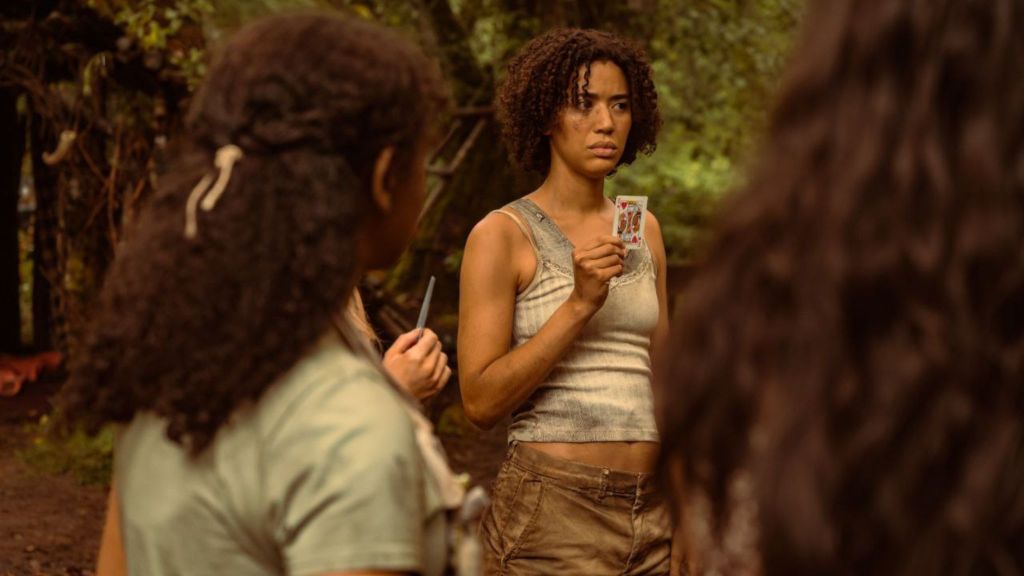 Jasmin Savoy Brown as Taissa holding a card in Yellowjackets episode 5 season 5