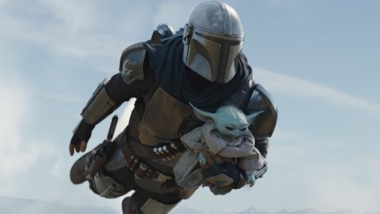 The Mandalorian and Grogu flying in the air