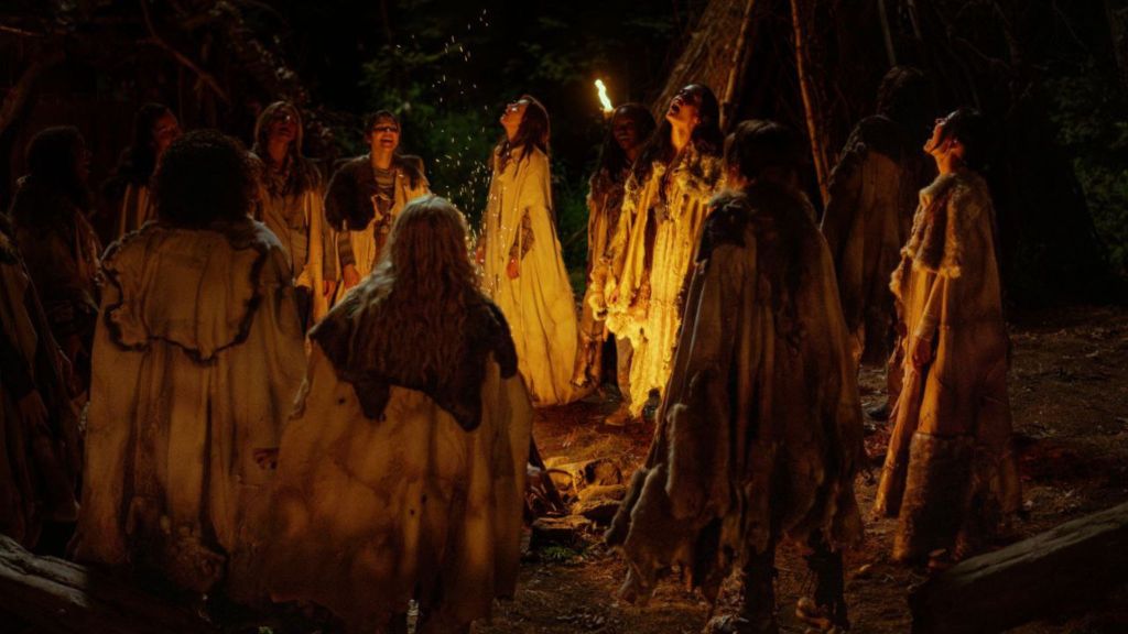 The Yellowjackest singing around a bonfire in Yellowjackets Season 3 Episode 6