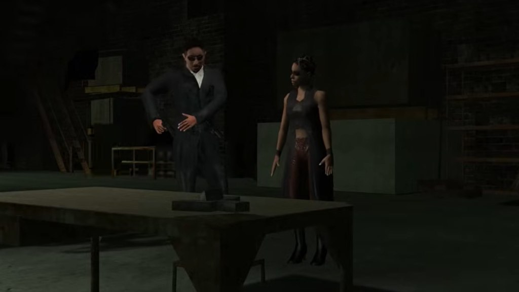 Niobe and Ghost standing next to a table as the telephone loads in
