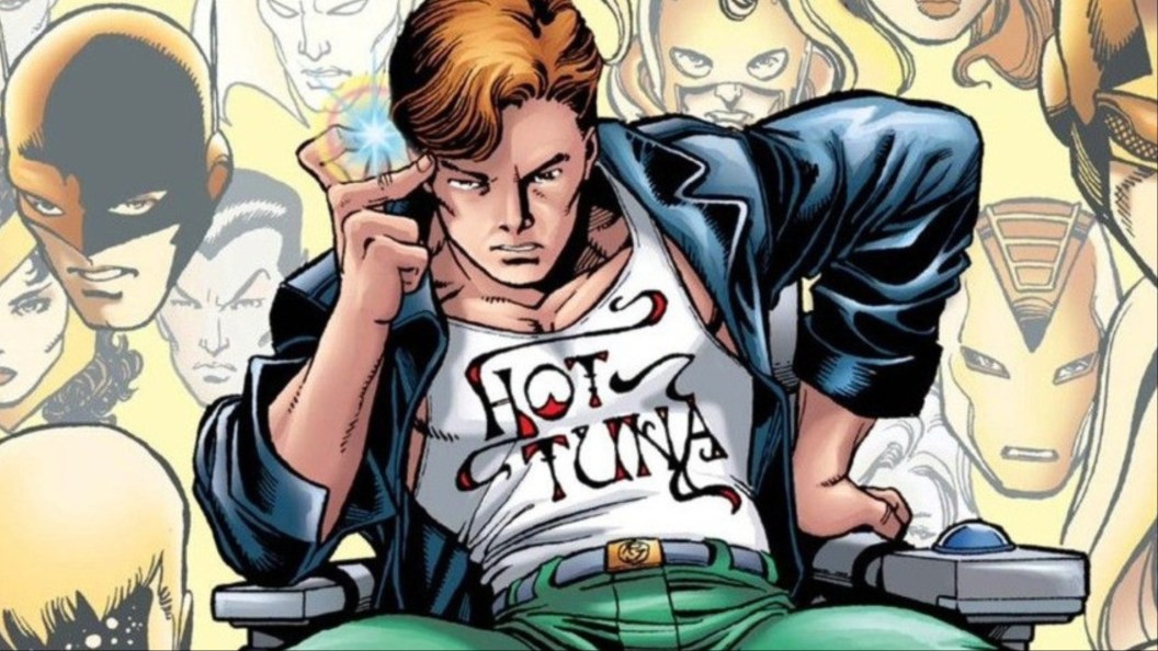 Rick Jones sitting in a chair in cront of many Marvel characters' heads.