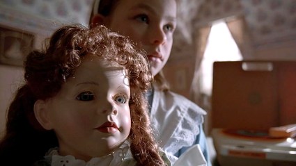 Creepy doll with girl behind it in The X-Files