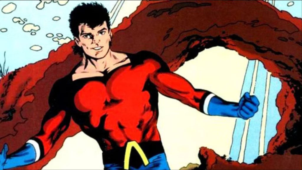 Aqualad under the water in front of a rock formation