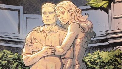 A statute of Wonder Woman holding Steve Trevor