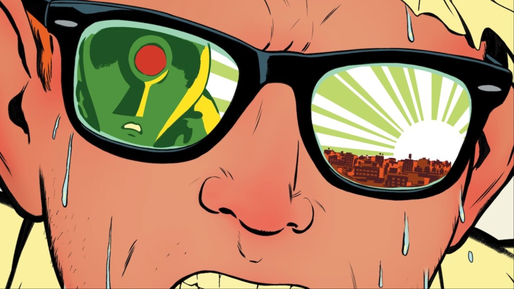 John Jones's sweating face, with the Martian Manhunter's face in one lens of his glasses and the white sun over Middleton in the other