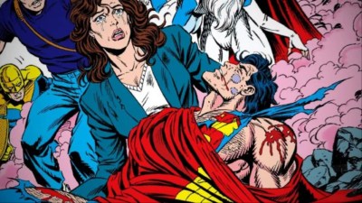 Lois Lane holding the dead Superman, who is wrapped in his cape