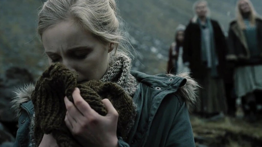 Icelandic woman sniffing Aquaman's sweater