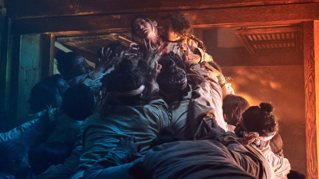 Zombies devouring a woman in Netflix's Kingdom