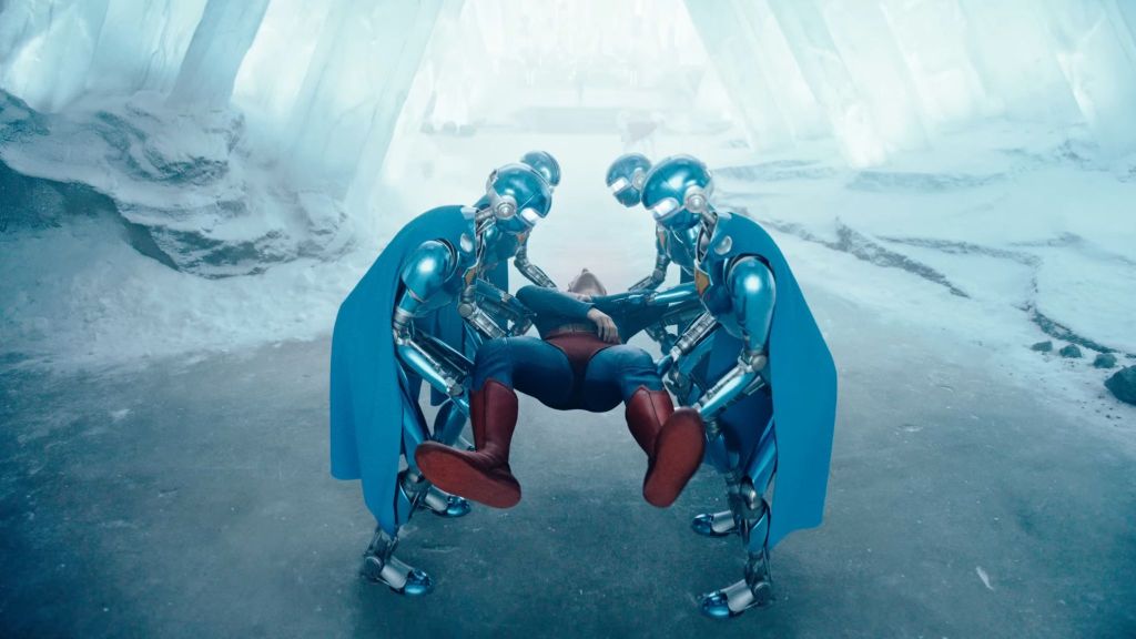 David Corenswet as Kal-el being carried by robots in Superman