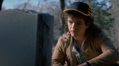 Dustin at Eddie's grave in Stranger Things Season 5