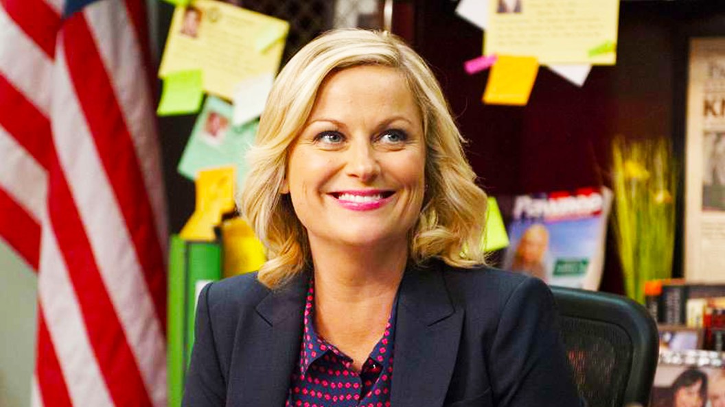 Leslie Knope smiling in Parks and Recreation