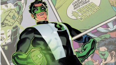 Kyle Rayner smiling n front of panels from Green Lantern comics