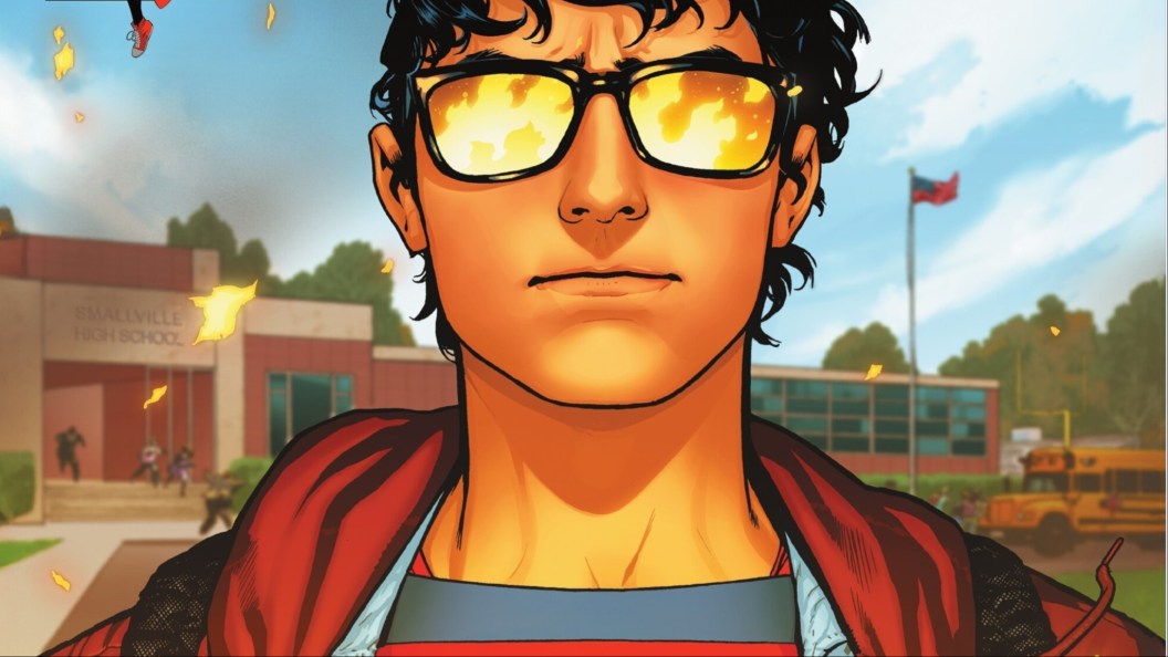 Superboy in front o his school with fire reflecting in his glasses