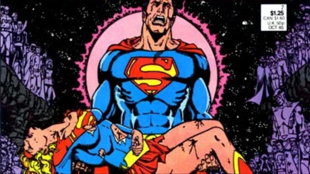 Superman crying as he holds the dead Supergirl, with the heroes of the DC Multiverse looking on behind them